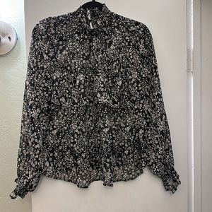 Black shirt with tan flowers